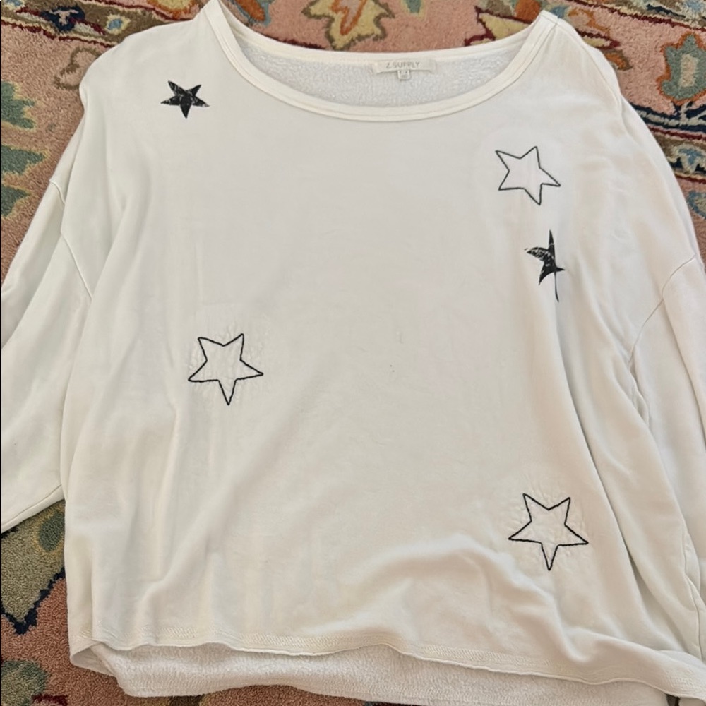White Long Sleeve Top with Black Star Accents